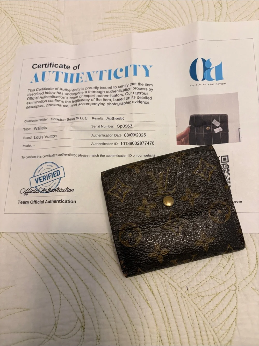Louis Vuitton trifold snap wallet. Authentication provided.